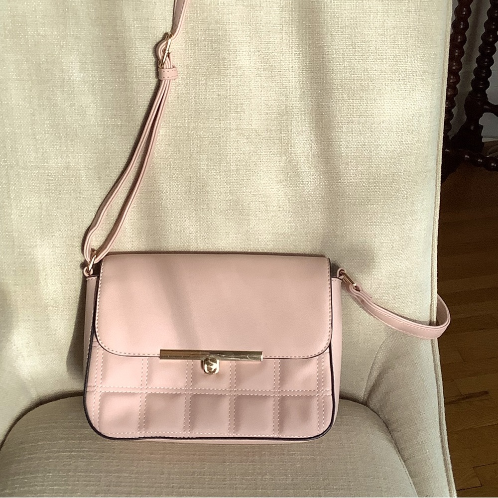 Beautiful blush colored Crossbody purse with adjustable strap
